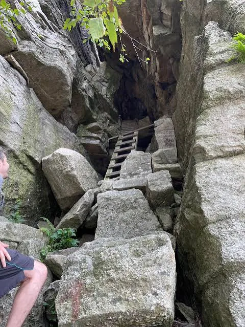 Boulders and a ladder at the start of the scramble